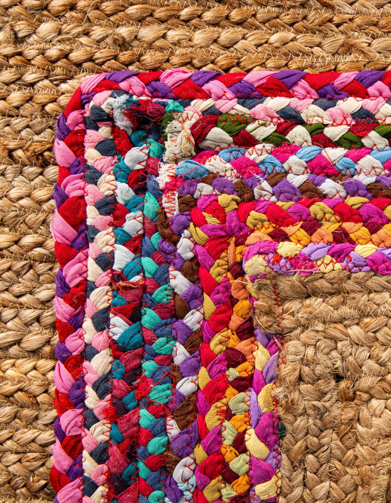 Natural Jute Area Rug with Vibrant Multicolor Braided Border Natural woven jute area rug with colorful braided border in contemporary home decor