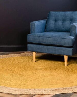 Artisan-made yellow oval jute rug designed with a natural woven border and durable braided construction. A stylish and sustainable choice for farmhouse, coastal, bohemian, and rustic-inspired spaces.